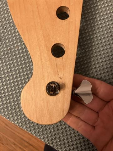 new tuner in bass headstock hole, showing excess space