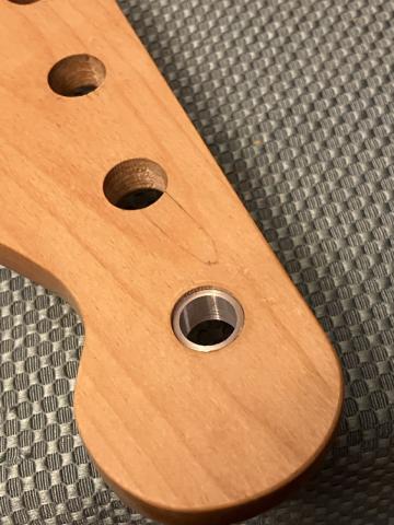 aluminum spacer in bass headstock hole