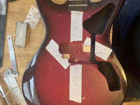 bass body with additional space carved out for alternate pickup