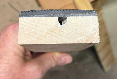 Heel end of cut fretboard, showing the end of the truss rod channel