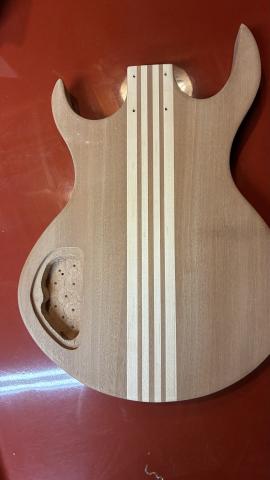 rear of guitar body showing empty control cavity
