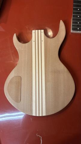 rear of guitar body showing cover over control cavity