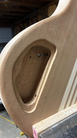 close up of the control cavity, with drill bit poking through the upper right