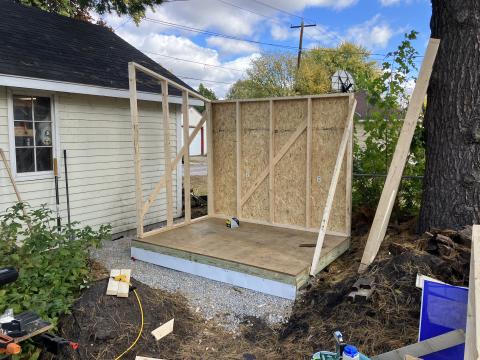 shed framing with a complete back wall and partial side wall