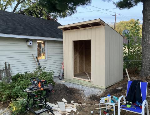 shed with siding and roof but missing door